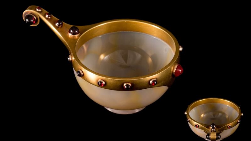 At O’Reilly’s AuctionRooms, Francis St, Dublin next Wednesday,  a Russian carved stone cup with gold and gemstone handle by work-master Erik Kollin, Saint Petersburg, circa late 19th century, with round carved agate bowl mounted on a 14ct yellow gold rim with integral handle, finished with raised garnet cabochons €8,000-€10,000