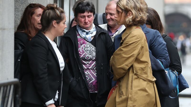 Catherine Devallonne, the mother of murdered French au-pair Sophie Lionnet, and her husband Stephane Devallonne, arrive at London’s Central Criminal Court. Photograph: Daniel Leal-Olivas/AFP/Getty Images