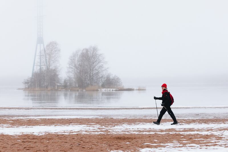 A walker at Hietaniemi beach in Helsinki. Photograph: Vesa Laitinen/The New York Times