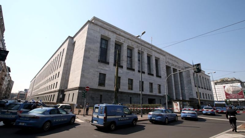 Police cars surround the court in  Milan. Photograph:  Stefano Rellandini/Reuters