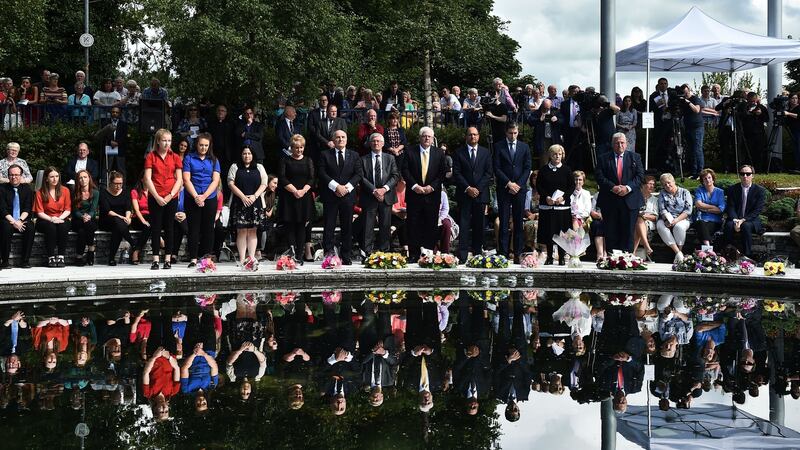 Dignitaries hold a minute’s silence during a remembrance service  for the victims of the Omagh bombing, in Omagh. Photograph: Charles McQuillan/Getty Images