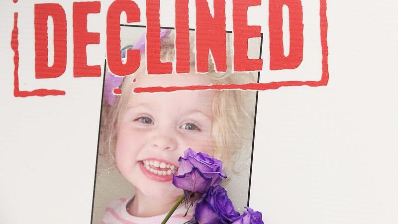 A picture of girl called Grace Duffy on a poster during a protest about the CF drug Orkambi  at Leinster House. Photograph: Stephen Collins/Collins