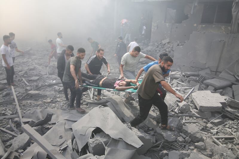 Palestinians evacuate wounded people after an Israeli air strike in Rafah refugee camp, southern Gaza. Photograph: Hatem Ali/AP