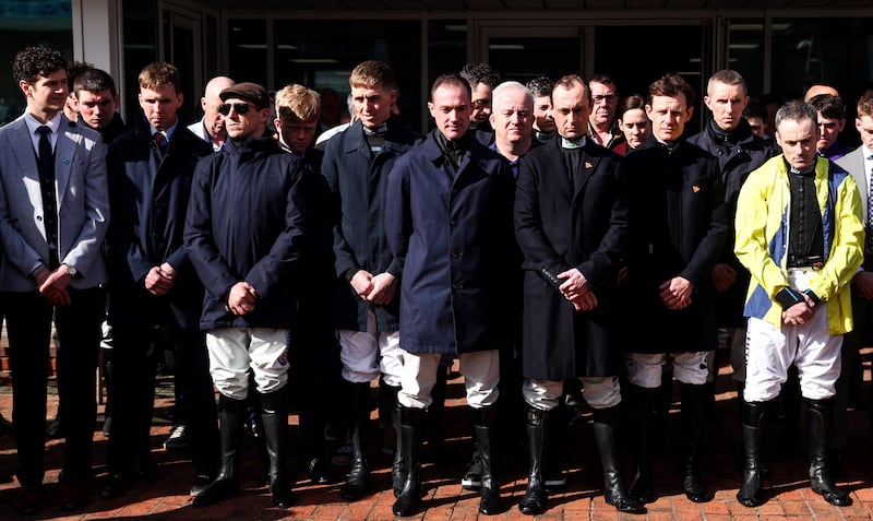 2025 Cheltenham Festival, Prestbury Park, Cheltenham, England 11/3/2025  
Jockeys applaud during a minute’s applause for Michael O’Sullivan prior to the start of the Cheltenham Festival
Mandatory Credit ©INPHO/Tom Maher