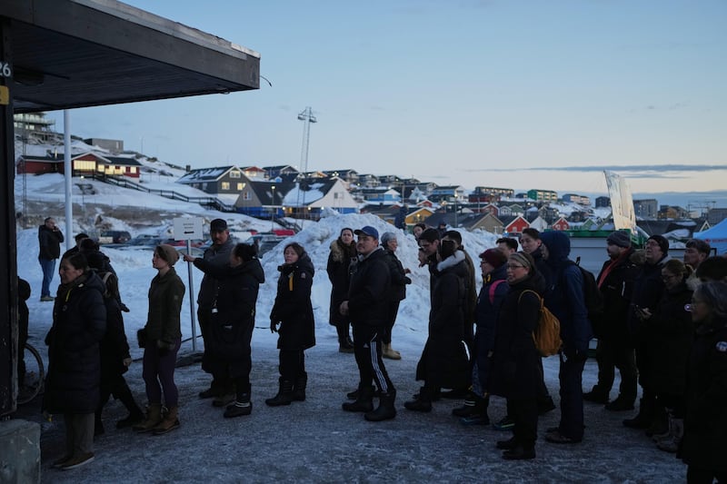 People line up outside a polling station to cast their vote in parliamentary elections in Nuuk, Greenland. Photograph: Evgeniy Maloletka/AP