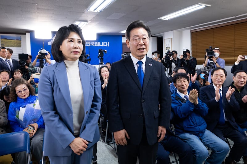 Lee Jae-myung, leader of the Democratic Party and his wife Kim Hye-kyung at a district office in Incheon, South Korea, on Thursday. Photograph: SeongJoon Cho/Bloomberg