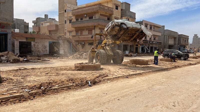 Workers clear a car from a street after Storm Daniel swept across eastern Libya, in the port city of Derna, eastern Libya, 17 September 2023. Unprecedented floods struck Libya after mediterranean Storm Daniel made landfall on 10 September. Intense rainfall from the storm in the country's eastern region caused the collapse of two dams south of the city of Derna, sweeping away entire neighborhoods. The death toll has surpassed 11,300 and over 34,000 people have been displaced across the country. The flooding exacerbated Libya's needs, where 800,000 people are reported in need of humanitarian assistance, the International Rescue Committee (IRC) said.