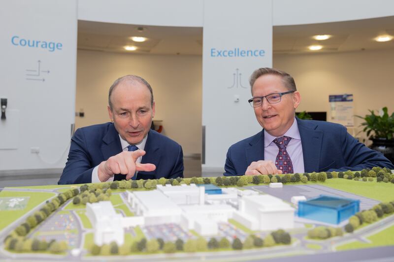 Mike McDermott shows Taoiseach Micheál Martin around the company's site in Grange Castle, Dublin, after announcing its new investment plans. Photograph: Naoise Culhane