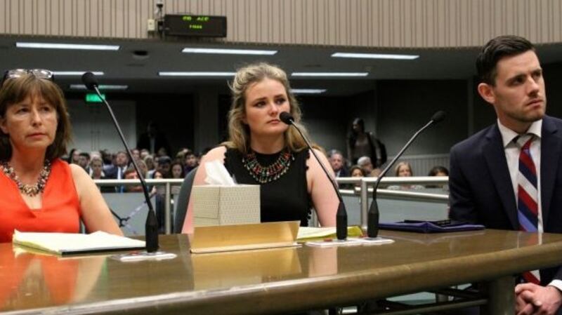 Aoife Beary (centre) tesifying at the Californian legislature, Sacramento on August 10th 2016, with her mother Angela and Vice Consul Kevin Byrne of the Irish Consulate General. Photograph: Darcy Costello/AP