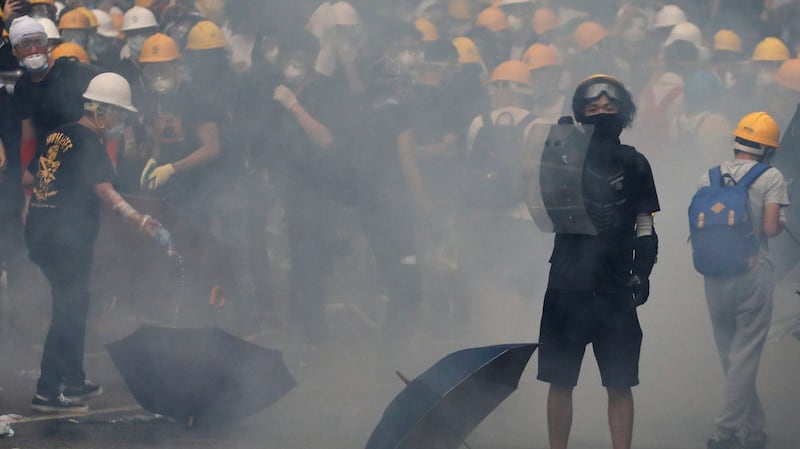 A protester holds a shield during the demonstration on Wednesday. Photograph: Athit Perawongmetha/Reuters