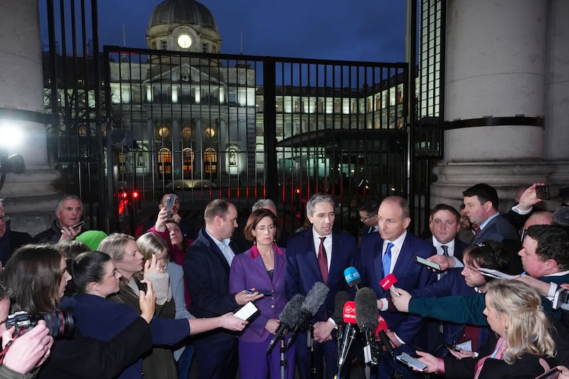 Government Chief Whip Hildegarde Naughton, Fine Gael leader Simon Harris, and Fianna Fáil leader Micheál Martin address the media outside Government Buildings, Dublin, after the Dáil was adjourned amid chaotic scenes. Brian Lawless/PA Wire