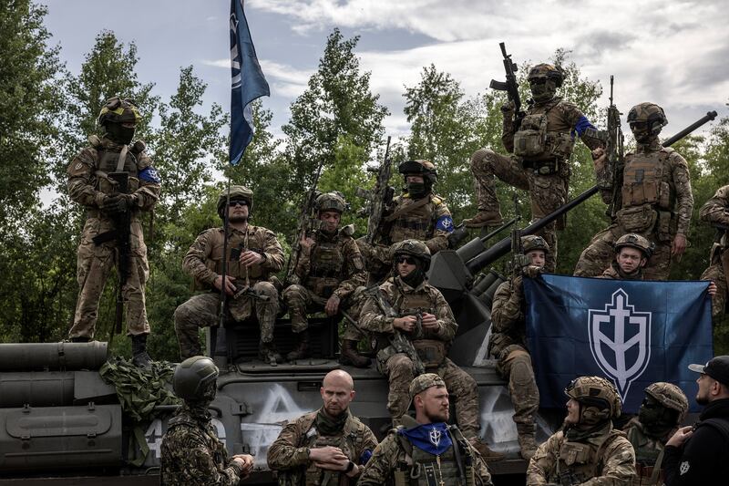 Members of the Free Russia Legion and Russian Volunteer Corps at a news conference after staging attacks in Russia, in northern Ukraine in May. Photograph: Finbarr O’Reilly/New York Times
                      