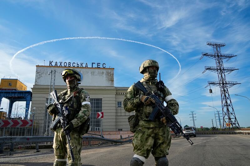 Russian troops guard an entrance to the Kakhovka hydroelectric
station in the Kherson region of south Ukraine. Photograph: AP