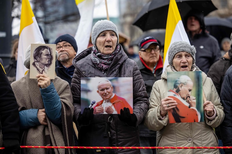 Supporters hold up images of late pope John Paul II on the 18th anniversary of his death in Warsaw, Poland on Sunday. Photograph: Wojtek Radwanski/AFP/Getty 