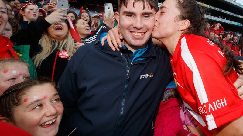 Cork’s Amy O’Connor kisses her partner Daniel Morrissey after the victory over Kilkenny. Photograph: James Crombie/Inpho