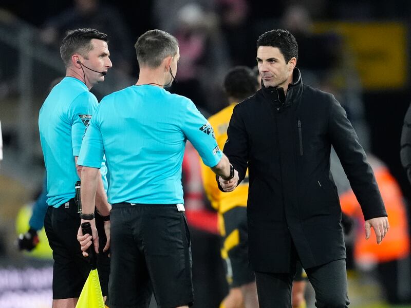 Arsenal manager Mikel Arteta shaking hands with an assistant referee with referee Michael Oliver (left) after the Wolves game. Photograph: Nick Potts/PA Wire