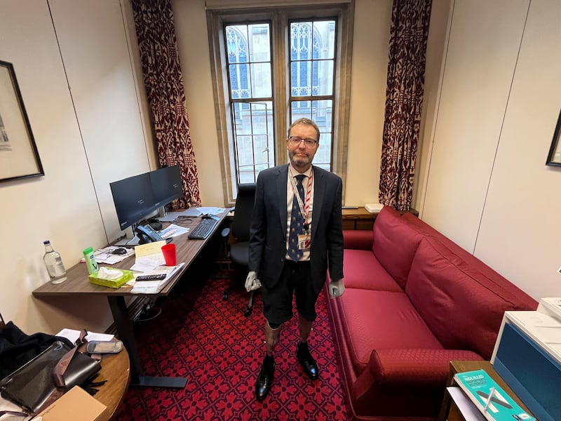 Craig Mackinlay pictured in his office in the House of Lords just before Christmas. He lost all four limbs to sepsis a year ago and became known as the Bionic MP while in the House of Commons. Photograph: Mark Paul