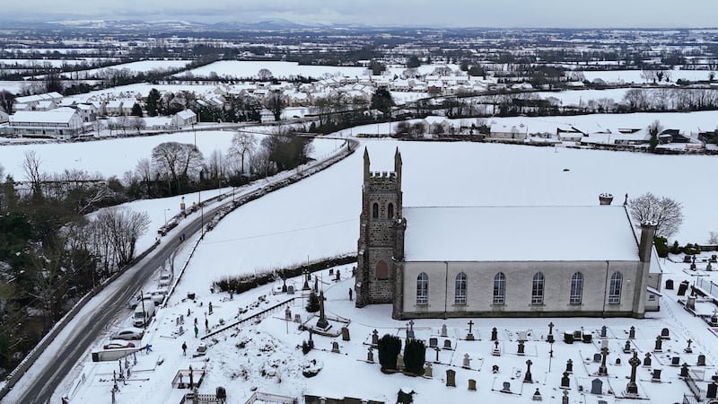 People make their way through snow to Mass at Holy Cross Catholic Church in Killeshin, County Laois, Ireland. Picture date: Sunday January 5, 2025. PA Photo. See PA story WEATHER Winter Ireland. Photo credit should read: Niall Carson/PA Wire