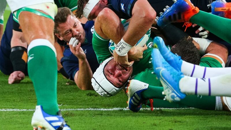 Ireland skipper  Rory Best twists to score the second try against Scotland. Photograph: Craig Mercer/Inpho