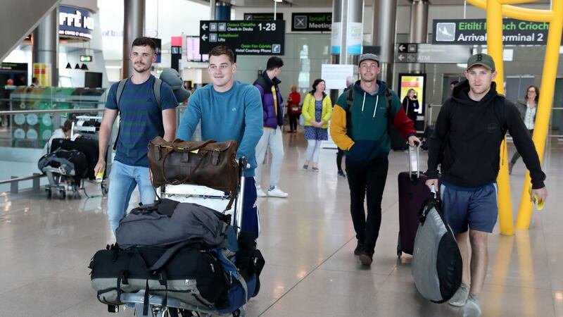 Philip Denmead, Conor Leavy, John Mulhearne and Eoghan Lally arrive back at Dublin Airport from Perth, Australia. Photograph: Crispin Rodwell/The Irish Times