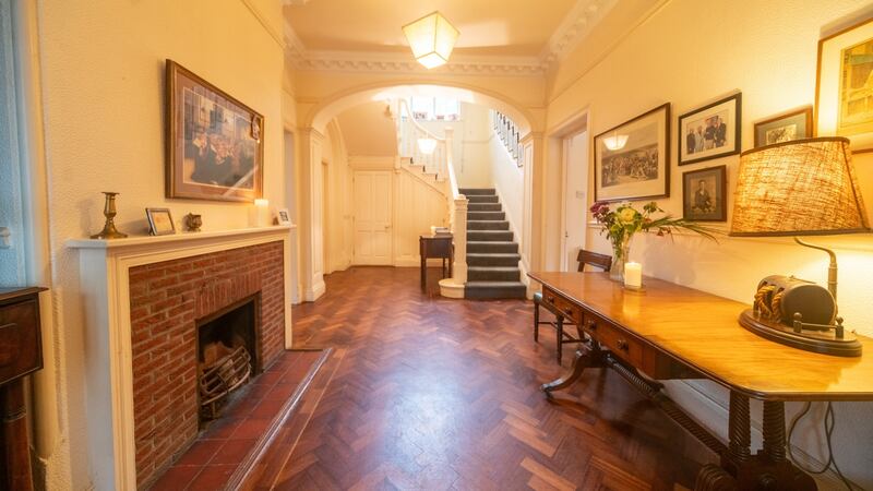 Hall with fireplace and parquet flooring