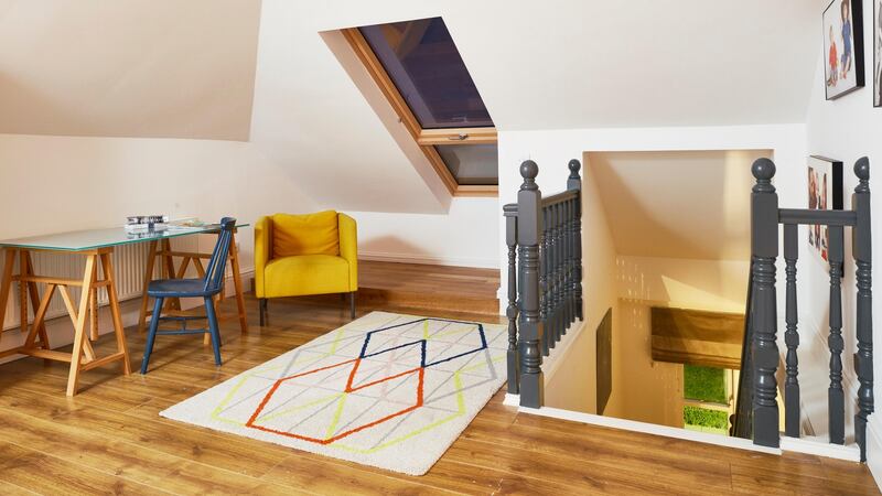 A removed wall and added Velux brightened the attic and landing below it. Photograph: Philip Lauterbach