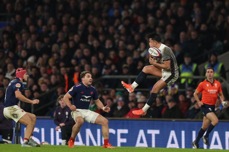 France's Antoine Dupont looks on as England's Marcus Smith gathers a high ball. Photograph: Adrian Dennis/AFP via Getty Images