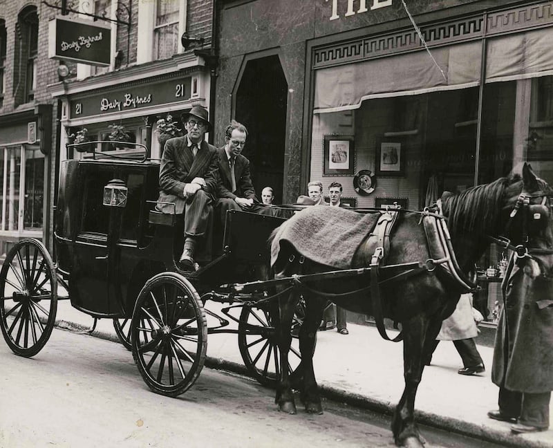 Patrick Kavanagh with writer Anthony Cronin after a pilgrimage to Sandymount Strand for Bloomsday arriving in South Anne Street:  'There was an underground, flourishing from the 1940s and 1950s, even tumbling into the 1980s, which was cultural long before culture was fashionable.' Photograph: Dermot Barry 