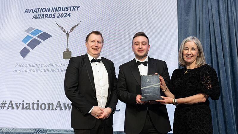 Ben Molloy, community lead at Business River, presents the aviation professional training award to Shane O'Neill & Eva O Keeffe, Atlantic Aviation Group