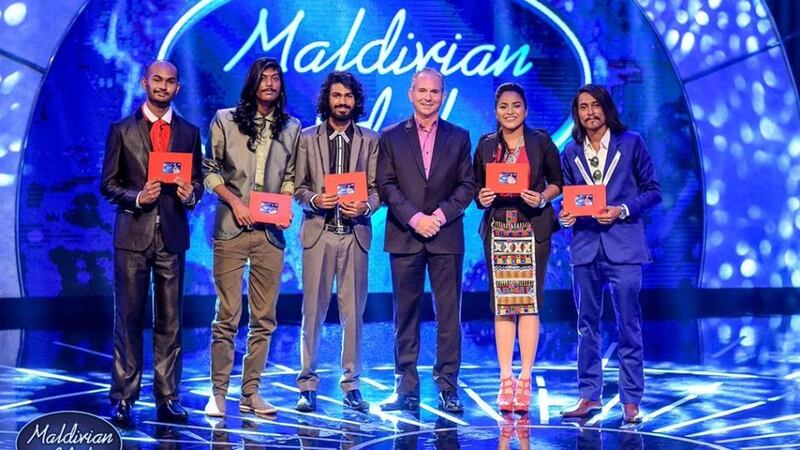 Andrew Healy pictured this week on the Bank of Maldives Twitter account, in the middle of a group of contestants in the Maldivian Idol competition