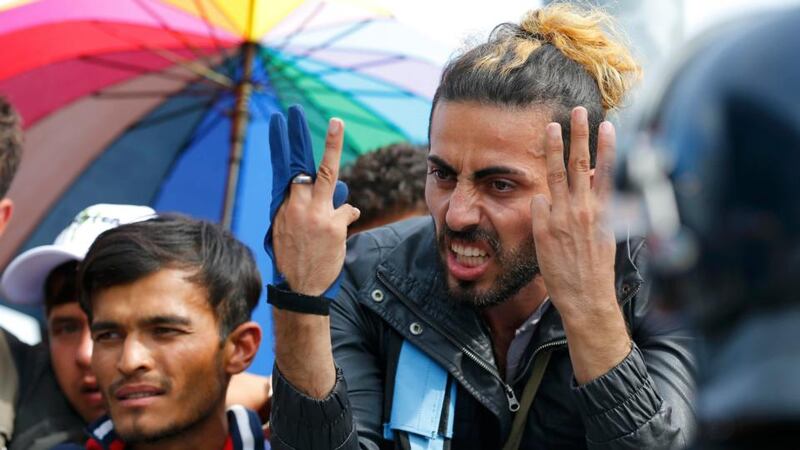 A migrant gestures as he talks to poilice at the Croatia-Slovenia border crossing at Bregana, Croatia on Sunday. Photograph: Laszlo Balogh/Reuters