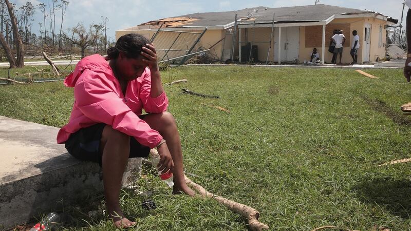 People wait for relief supplies to arrive at Treasure Cay Airport following Hurricane Dorian. Photograph: Scott Olson/Getty Images