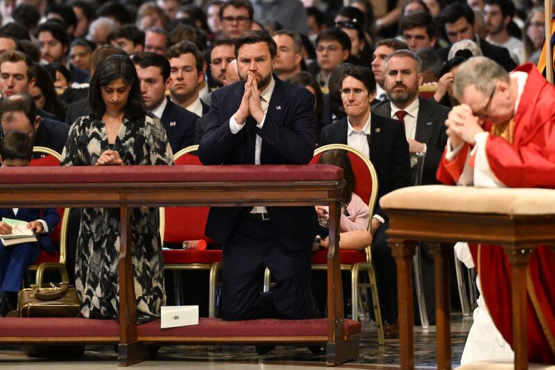 JD Vance and his wife Usha, left, attend Good Friday Mass at St Peter’s Basilica at the Vatican. Photograph: Kenny Holston/The New York Times