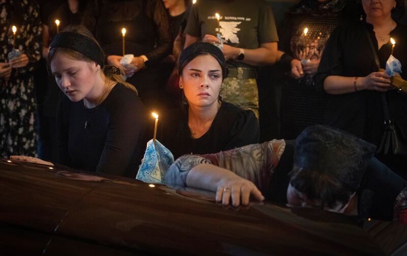 Relatives mourn at the coffin of a soldier, codename Fanat, killed by the Russian troops. Photograph: Efrem Lukatsky/AP