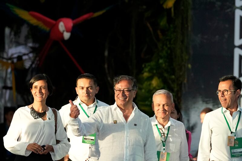 Colombia’s president Gustavo Petro gives a thumbs up as he departs the summit in Belem, Brazil. Photograph; Eraldo Peres/AP