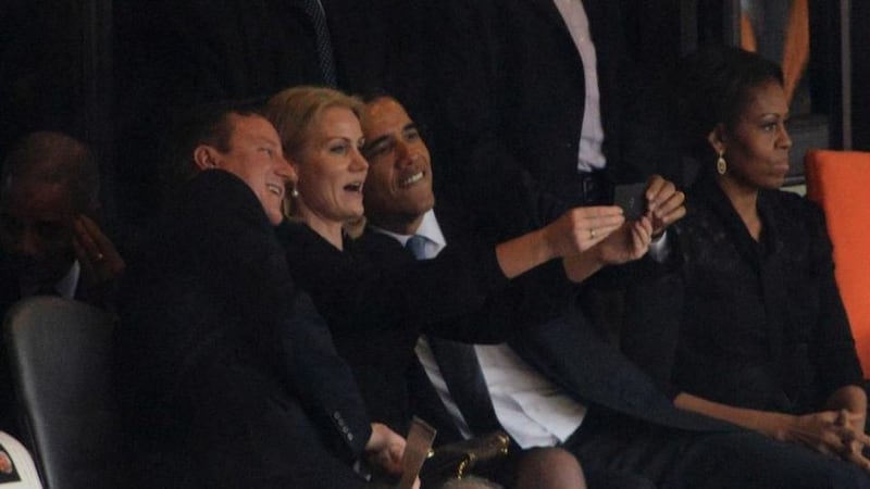 Picture 3: British prime minister David Cameron, Danish PM Helle Thorning-Schmidt and US president Barack Obama mid-selfie during the memorial service for Nelson Mandela in Johannesburg, South Africa. The event was in some ways overshadowed by a controversy over the quality of sign language performed during the ceremony.