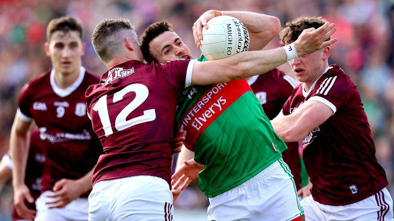 Mayo’s Jason Doherty and Johnny Heaney of Galway. Photograph: Ryan Byrne/Inpho