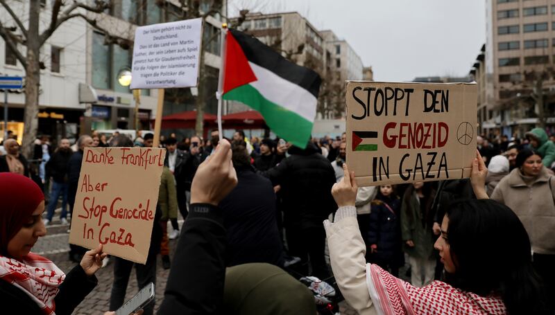 People hold placards reading 'stop genocide in Gaza' in Frankfurt-am-Main earlier this month. Photograph: Ronald Wittek/EPA-EFE