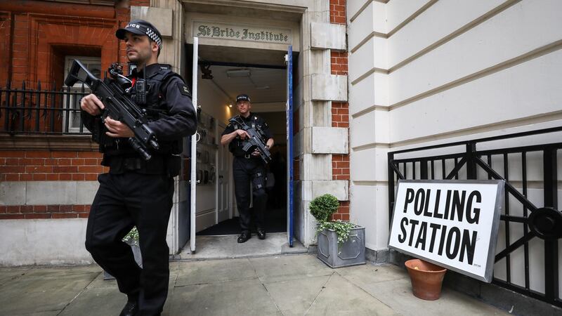 City of London armed police officers leave the St Bride Institute polling station in the City of London, UK. Photograph: Chris Ratcliffe/Bloomberg