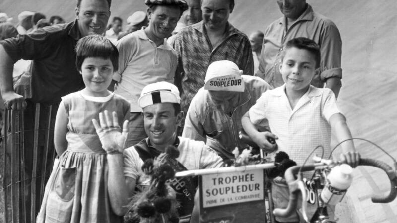 Shay Elliott takes a ride in a pram after arriving in  Toulouse during the 1961 Tour de France. Photograph: Keystone/Getty Images