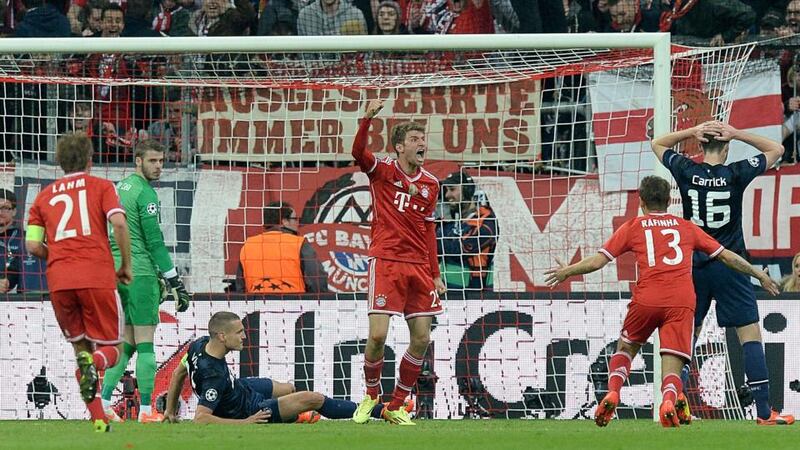 Bayern Munich’s Thomas Muller celebrates scoring his side’s second goal. Photograph: Martin Rickett/PA Wire