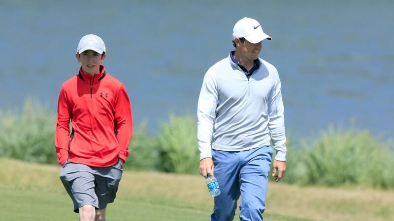 Rory McIlroy with the then 13-year-old Tom McKibbin at the Dell Match Play in Austin, Texas, in March 2016. Photograph: David Cannon/Getty Images