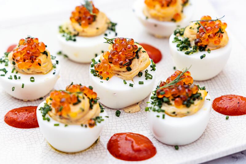 Devilled eggs with romesco sauce and trout caviar with chives. Photograph: Harry Weir