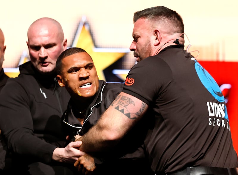 Conor Benn is held back by security after being struck with an egg by Chris Eubank Jr during a press conference on Tuesday. Photograph: Richard Sellers/PA Wire