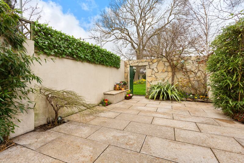 The rear garden is paved and has access to a residents only communal garden