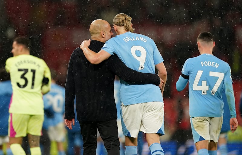 Manchester City manager Pep Guardiola with Erling Haaland following a Premier League match against Manchester United at Old Trafford in October 2023: Martin Rickett/PA