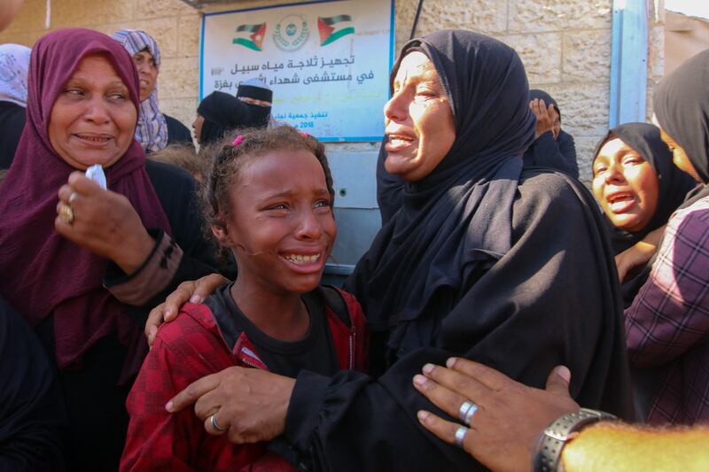 Palestinian mourners cry during a funeral procession of the victims of an Israeli attack on Nuseirat refugee camp in Gaza on June 7th. Photograph: Saeed Jaras/Middle East Images/AFP via Getty Images