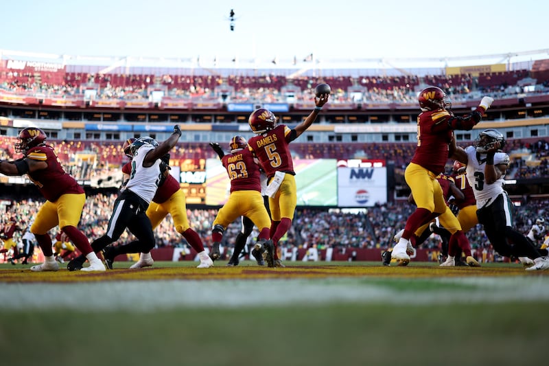 Washington Commanders quarterback Jayden Daniels  attempts a pass against the Philadelphia Eagles during the second quarter at Northwest Stadium in Landover, Maryland. Photograph: Scott Taetsch/Getty Images