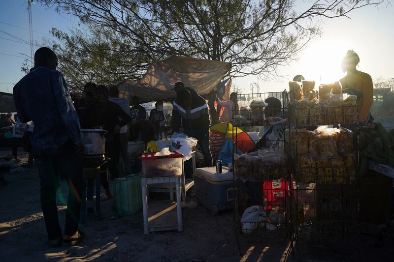 Migrants at a makeshift tent city in Reynosa, Mexico, on Tuesday, December 27th, 2022, as they wait to seek asylum in the US. Photograph: Veronica G Cardenas/New York Times