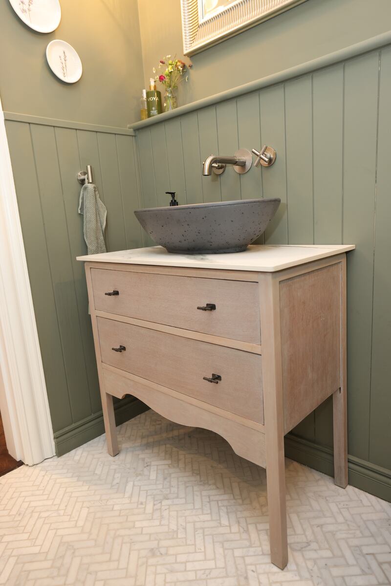 Downstairs bathroom has an upcycled vanity unit. Photograph: Bryan O’Brien

